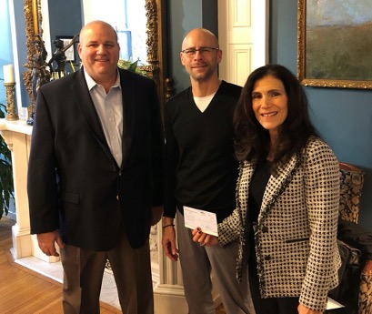 Eisenberg Winkler Jeck Schwartz Schoenhaus & Sherry, P.C., shareholders Daniel Jeck (left) and Nancy Winkler (right) present a donation from the law firm to Paul Geller (center), regional Executive Director of the Crohn's & Colitis Foundation.
